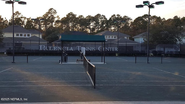 view of tennis court with fence