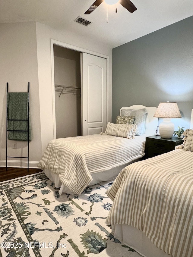 2714 Las Calinas Blvd, Saint Augustine, FL 32095 - bedroom featuring a closet, visible vents, baseboards, ceiling fan, and wood finished floors