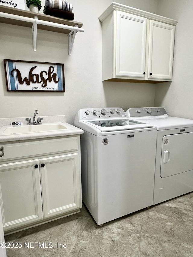 2714 Las Calinas Blvd, Saint Augustine, FL 32095 - washroom featuring washer and clothes dryer, cabinet space, and a sink