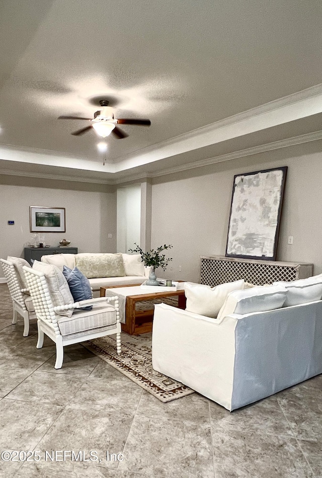 2714 Las Calinas Blvd, Saint Augustine, FL 32095 - living area featuring ornamental molding, a tray ceiling, a textured ceiling, and ceiling fan