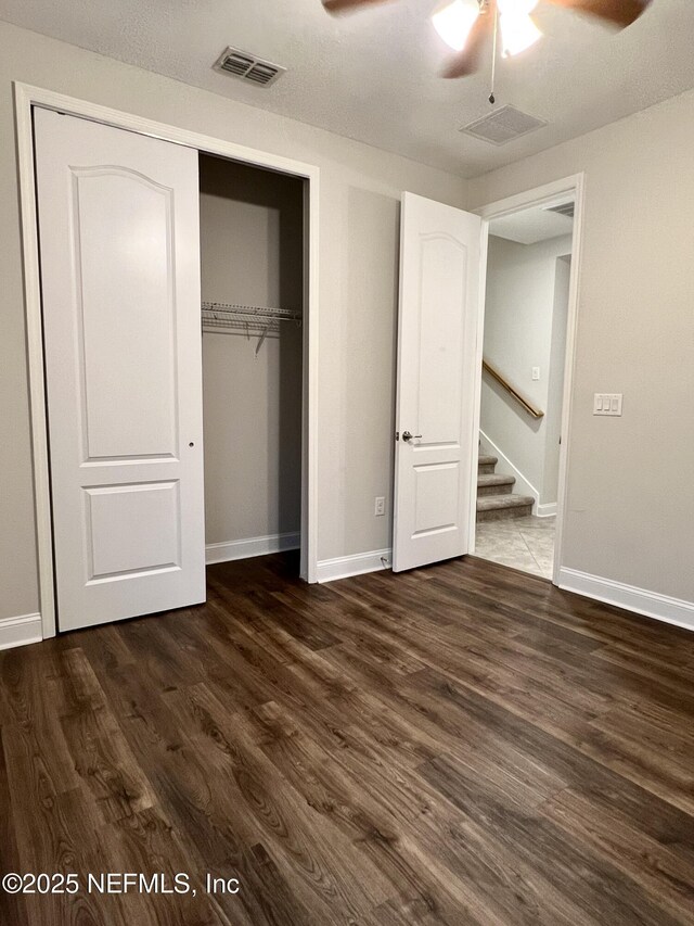 2714 Las Calinas Blvd, Saint Augustine, FL 32095 - unfurnished bedroom with dark wood-style floors, visible vents, a closet, and baseboards