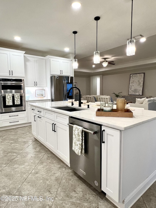 2714 Las Calinas Blvd, Saint Augustine, FL 32095 - kitchen featuring a sink, an island with sink, appliances with stainless steel finishes, and pendant lighting