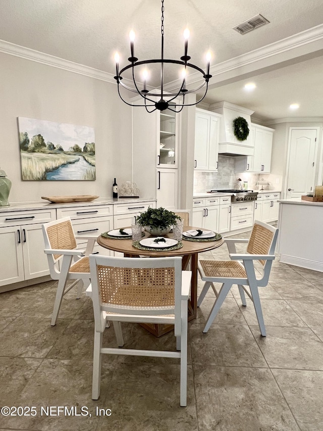 2714 Las Calinas Blvd, Saint Augustine, FL 32095 - dining area featuring ornamental molding, a chandelier, and visible vents