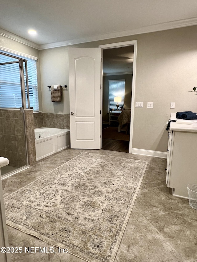 2714 Las Calinas Blvd, Saint Augustine, FL 32095 - ensuite bathroom featuring crown molding, vanity, a garden tub, ensuite bath, and baseboards