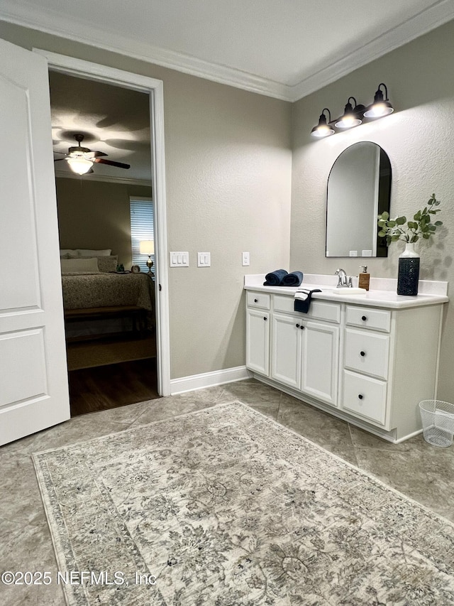 2714 Las Calinas Blvd, Saint Augustine, FL 32095 - bathroom with vanity, ornamental molding, baseboards, ensuite bath, and ceiling fan
