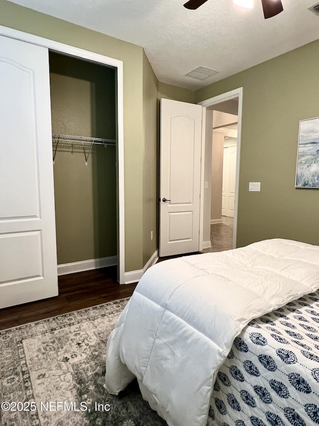 2714 Las Calinas Blvd, Saint Augustine, FL 32095 - bedroom with a closet, visible vents, baseboards, wood finished floors, and a ceiling fan