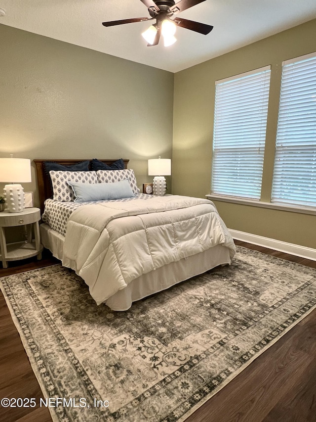 2714 Las Calinas Blvd, Saint Augustine, FL 32095 - bedroom with a ceiling fan, dark wood-style flooring, and baseboards