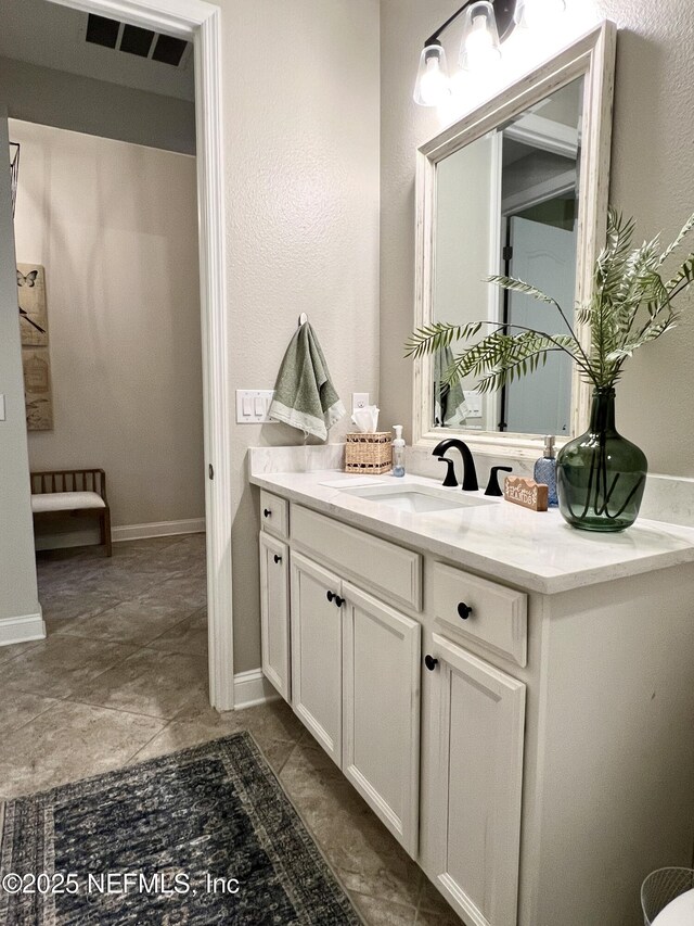 2714 Las Calinas Blvd, Saint Augustine, FL 32095 - bathroom with baseboards, visible vents, and vanity