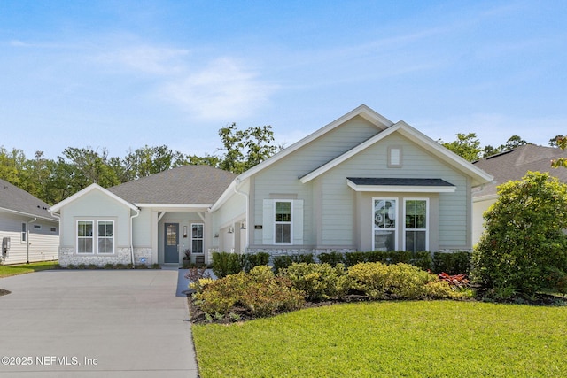 280 Quail Vista Dr, Ponte Vedra, FL 32081 - ranch-style house featuring a front yard, an attached garage, and concrete driveway