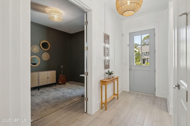 280 Quail Vista Dr, Ponte Vedra, FL 32081 - entrance foyer with ornamental molding, light wood-style flooring, and baseboards