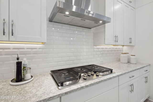 280 Quail Vista Dr, Ponte Vedra, FL 32081 - kitchen featuring tasteful backsplash, wall chimney range hood, white cabinets, and stainless steel gas stovetop