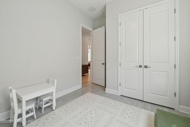 280 Quail Vista Dr, Ponte Vedra, FL 32081 - bedroom with wood finished floors, baseboards, a closet, and visible vents