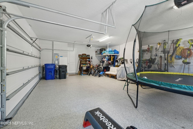 280 Quail Vista Dr, Ponte Vedra, FL 32081 - garage featuring a garage door opener, a trampoline, and electric panel