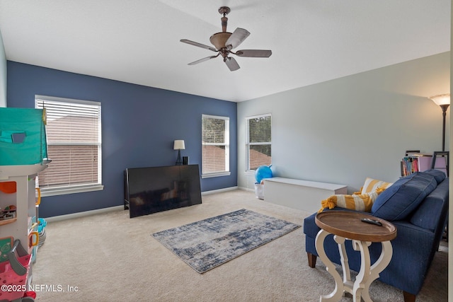 living room featuring a ceiling fan, carpet floors, and baseboards