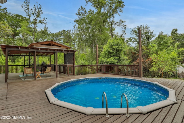 12847 Swamp Owl Ln, Jacksonville, FL 32258 - view of pool featuring a wooden deck and view of scattered trees