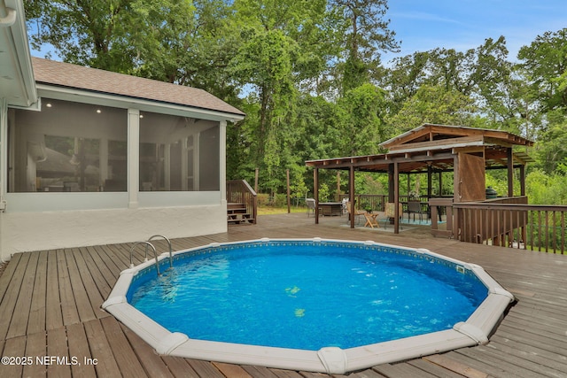 12847 Swamp Owl Ln, Jacksonville, FL 32258 - outdoor pool featuring a sunroom and a wooden deck