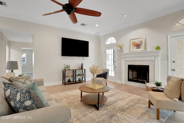 12847 Swamp Owl Ln, Jacksonville, FL 32258 - living area featuring plenty of natural light, recessed lighting, light wood-style flooring, a ceiling fan, and a tile fireplace