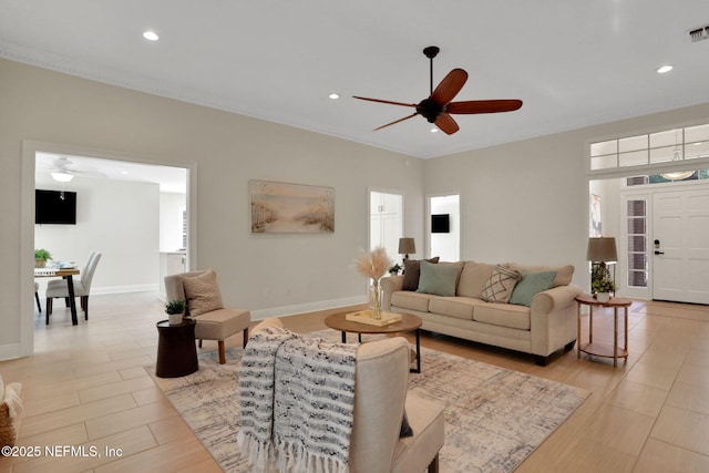 12847 Swamp Owl Ln, Jacksonville, FL 32258 - living area featuring a ceiling fan, recessed lighting, baseboards, and ornamental molding