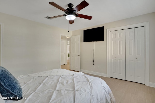 12847 Swamp Owl Ln, Jacksonville, FL 32258 - bedroom featuring baseboards, a closet, a ceiling fan, and wood finished floors