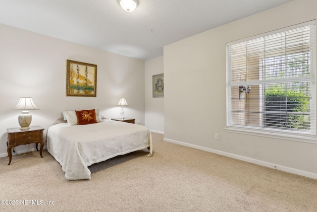 9831 Del Webb Pkwy Unit 3107, Jacksonville, FL 32256 - bedroom featuring baseboards and carpet floors