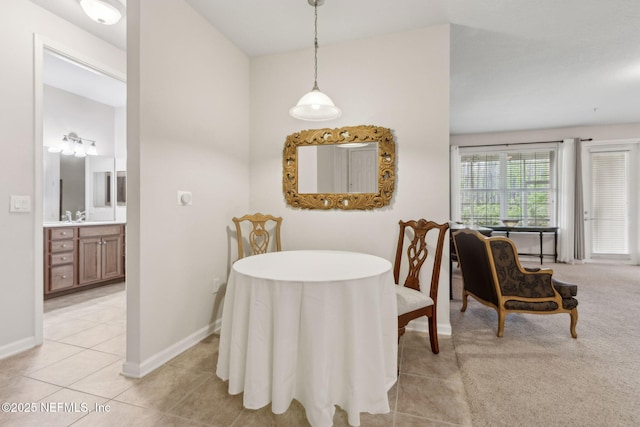 9831 Del Webb Pkwy Unit 3107, Jacksonville, FL 32256 - dining room with light tile patterned floors and baseboards