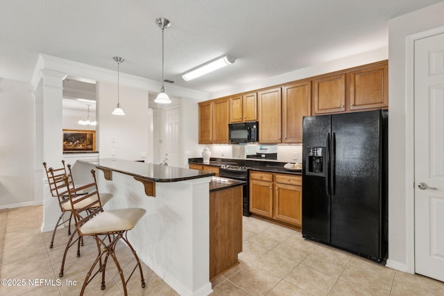 9831 Del Webb Pkwy Unit 3107, Jacksonville, FL 32256 - kitchen featuring a breakfast bar, light tile patterned floors, decorative light fixtures, brown cabinets, and black appliances