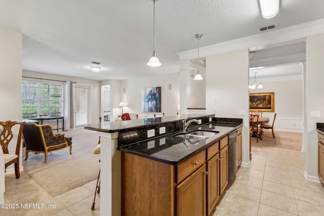 9831 Del Webb Pkwy Unit 3107, Jacksonville, FL 32256 - kitchen with visible vents, light tile patterned floors, dishwasher, a sink, and brown cabinets