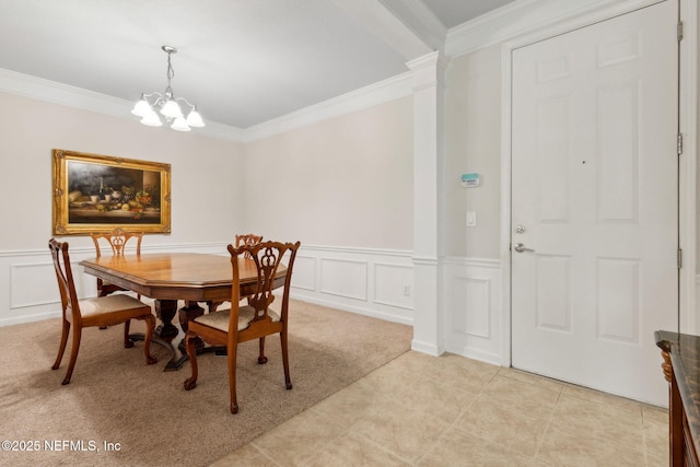 9831 Del Webb Pkwy Unit 3107, Jacksonville, FL 32256 - dining area featuring a decorative wall, ornamental molding, a wainscoted wall, light carpet, and a notable chandelier