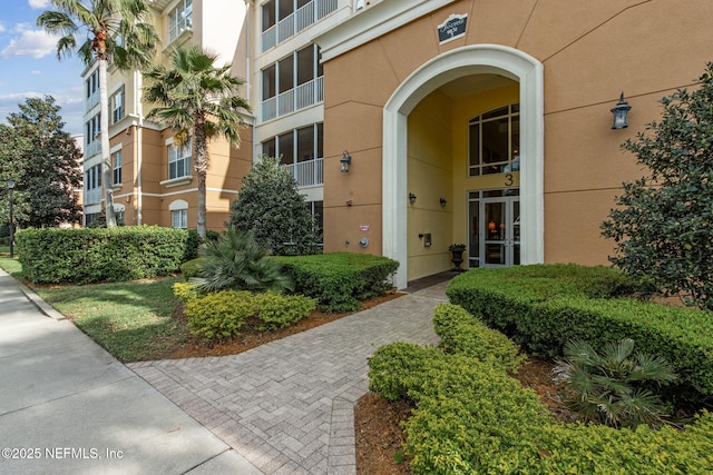 9831 Del Webb Pkwy Unit 3107, Jacksonville, FL 32256 - doorway to property with stucco siding