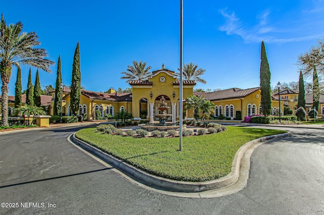 9831 Del Webb Pkwy Unit 3107, Jacksonville, FL 32256 - mediterranean / spanish house featuring a tiled roof and stucco siding