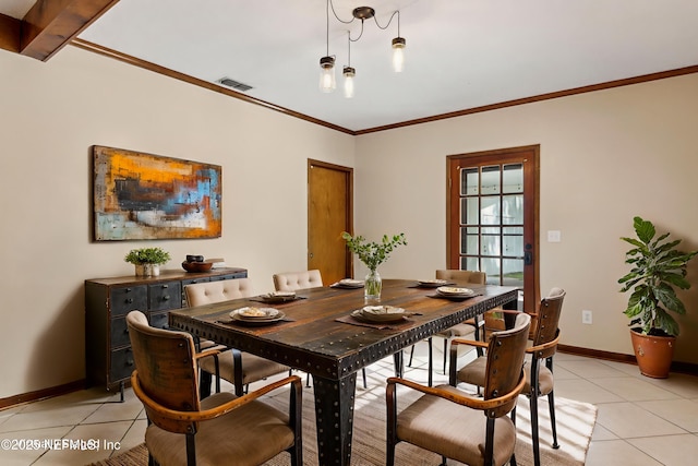 54223 Lisa Dr, Callahan, FL 32011 - dining room featuring light tile patterned floors, crown molding, and baseboards