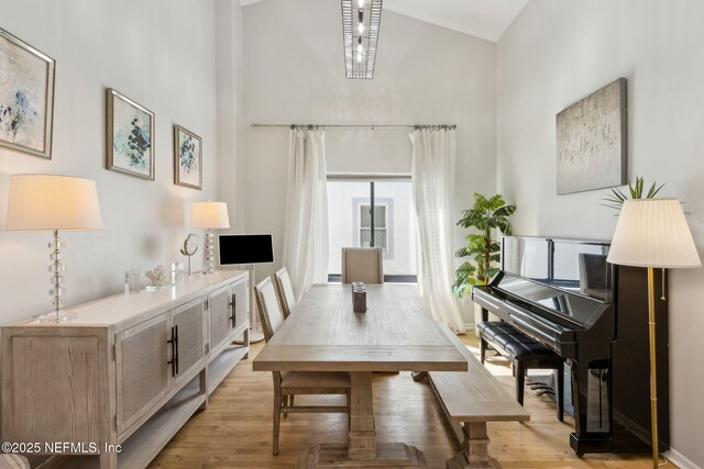 185 Crosscove Cir, Ponte Vedra Beach, FL 32082 - dining space featuring light wood-style flooring, a high ceiling, and baseboards