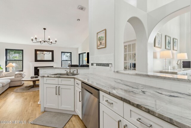 185 Crosscove Cir, Ponte Vedra Beach, FL 32082 - kitchen featuring visible vents, dishwasher, a sink, open floor plan, and a notable chandelier