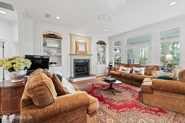 1952 Quaker Ridge Dr, Green Cove Springs, FL 32043 - living area with built in features, visible vents, and crown molding