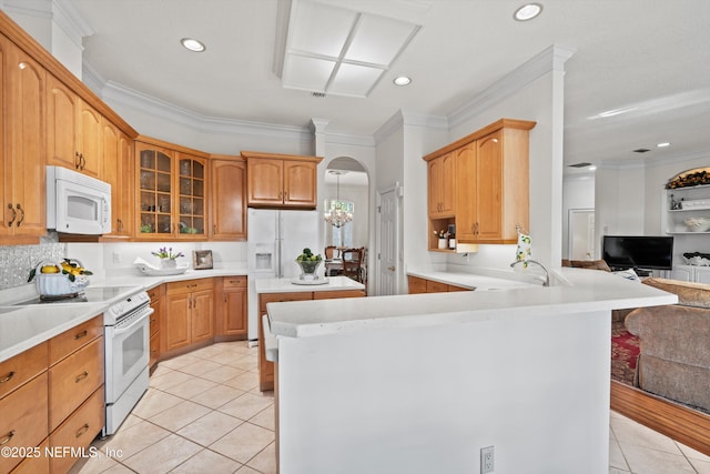 1952 Quaker Ridge Dr, Green Cove Springs, FL 32043 - kitchen with glass insert cabinets, light tile patterned floors, open floor plan, white appliances, and a peninsula