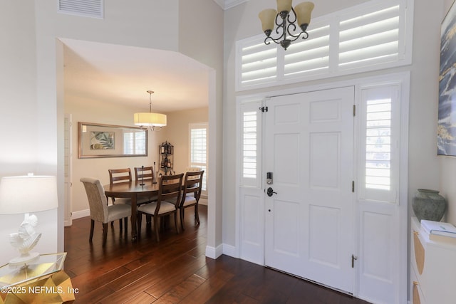 4394 Apple Tree Pl, Jacksonville, FL 32258 - foyer entrance featuring dark wood finished floors, baseboards, a chandelier, and visible vents