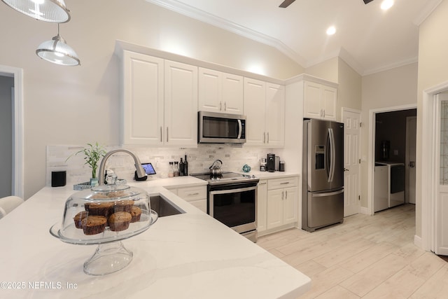 4394 Apple Tree Pl, Jacksonville, FL 32258 - kitchen featuring decorative backsplash, white cabinetry, a sink, and stainless steel appliances