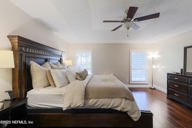 4394 Apple Tree Pl, Jacksonville, FL 32258 - bedroom featuring baseboards, dark wood-style flooring, a textured ceiling, and a ceiling fan