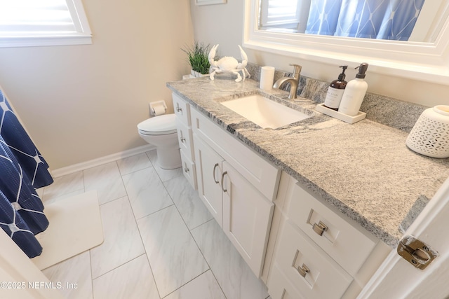 4394 Apple Tree Pl, Jacksonville, FL 32258 - bathroom with baseboards, marble finish floor, toilet, and vanity