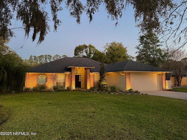 4394 Apple Tree Pl, Jacksonville, FL 32258 - ranch-style house with driveway, a front yard, a garage, and brick siding