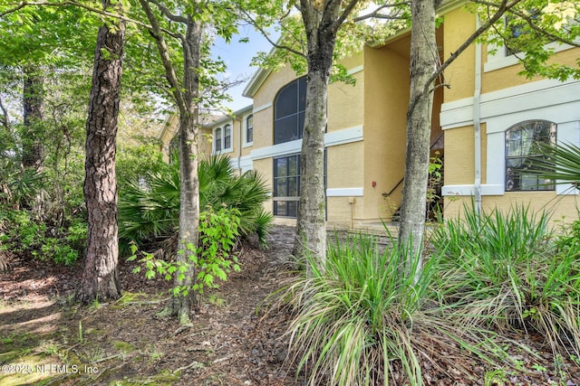 1825 Vista Cove Rd, Saint Augustine, FL 32084 - view of property exterior with stucco siding