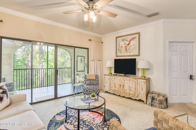 1825 Vista Cove Rd, Saint Augustine, FL 32084 - living room featuring crown molding, a ceiling fan, and light carpet