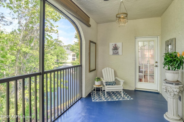 1825 Vista Cove Rd, Saint Augustine, FL 32084 - sunroom / solarium featuring a chandelier