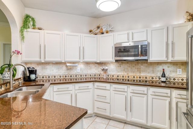1825 Vista Cove Rd, Saint Augustine, FL 32084 - kitchen featuring appliances with stainless steel finishes, a sink, white cabinetry, and tasteful backsplash