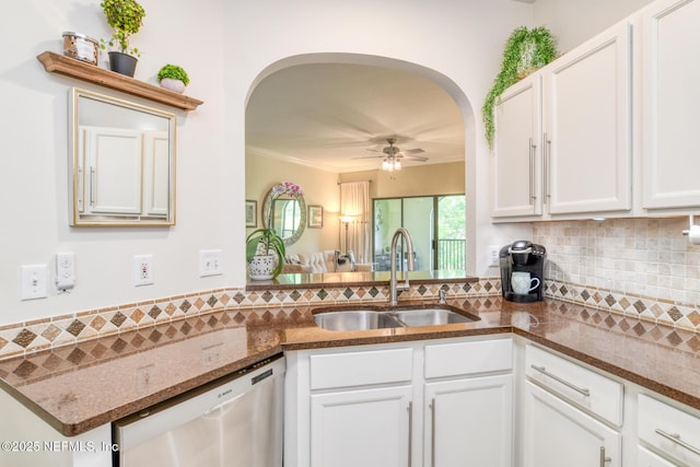 1825 Vista Cove Rd, Saint Augustine, FL 32084 - kitchen featuring stainless steel dishwasher, a sink, arched walkways, a ceiling fan, and tasteful backsplash