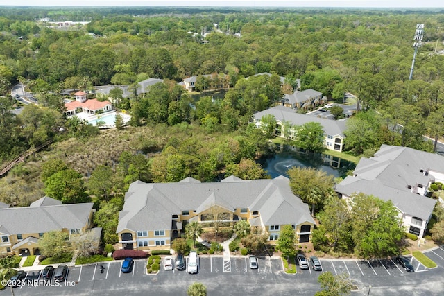 1825 Vista Cove Rd, Saint Augustine, FL 32084 - aerial perspective of suburban area with a heavily wooded area and a large body of water