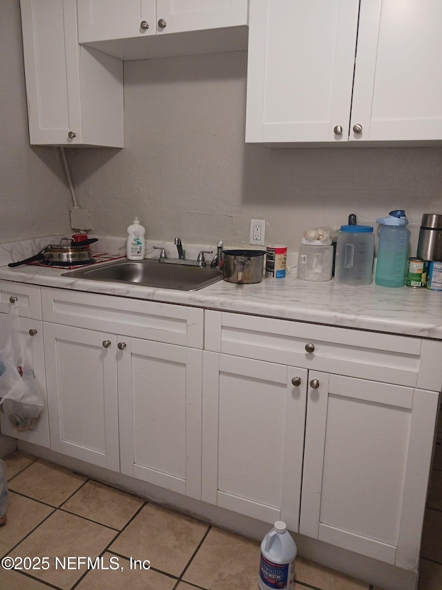 1419 Brady St Unit 1-2, Jacksonville, FL 32209 - kitchen with white cabinets, light countertops, and a sink