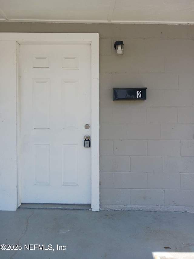 1419 Brady St Unit 1-2, Jacksonville, FL 32209 - doorway to property featuring concrete block siding