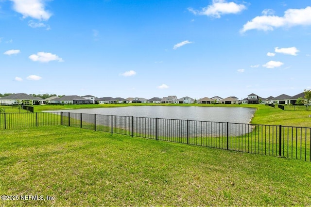 view of water feature featuring fence and a residential view