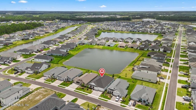birds eye view of property featuring a residential view and a water view